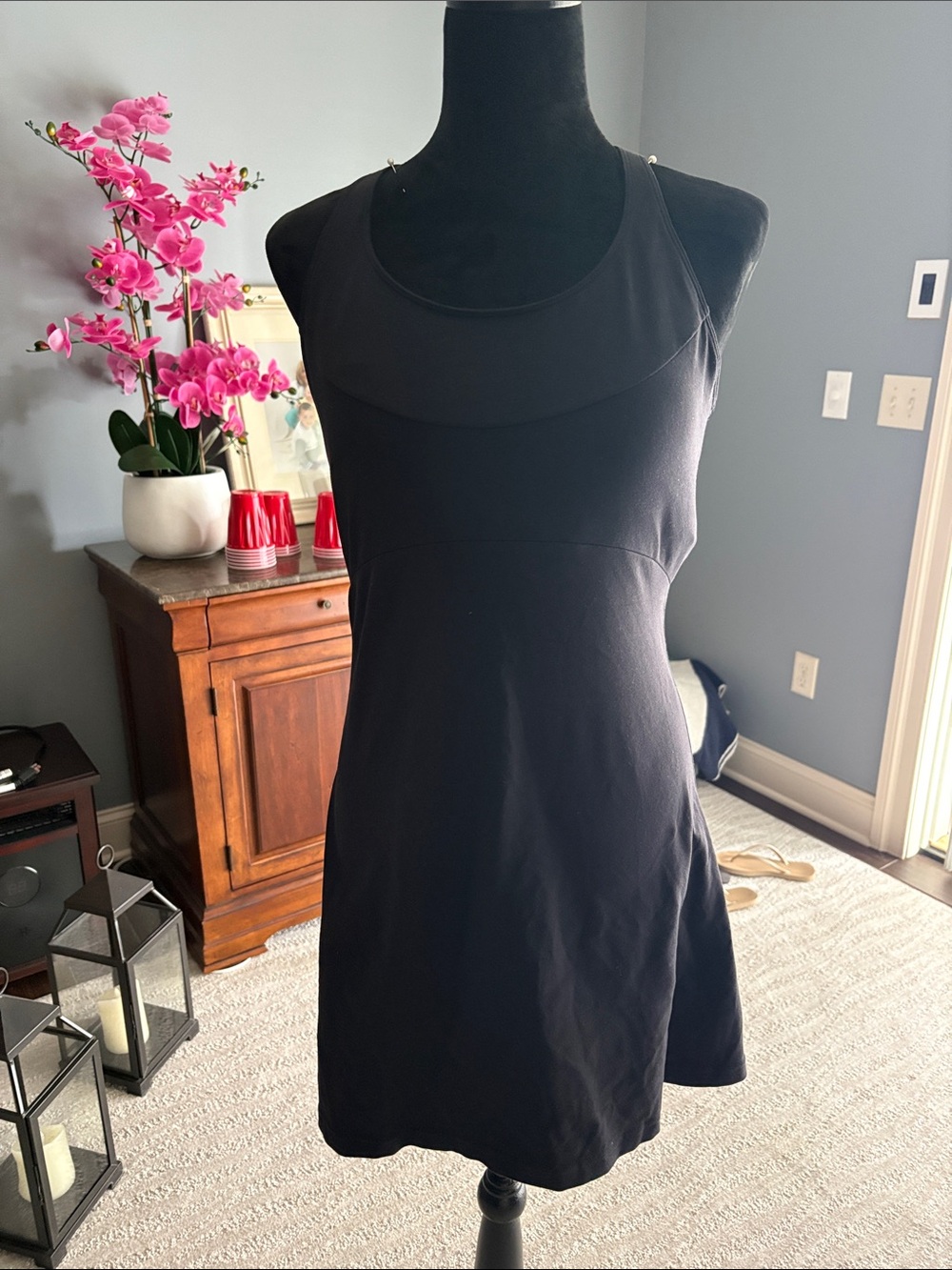 Athletic woman’s  Black Sleeveless A-Line Dress - with built in bra pads.